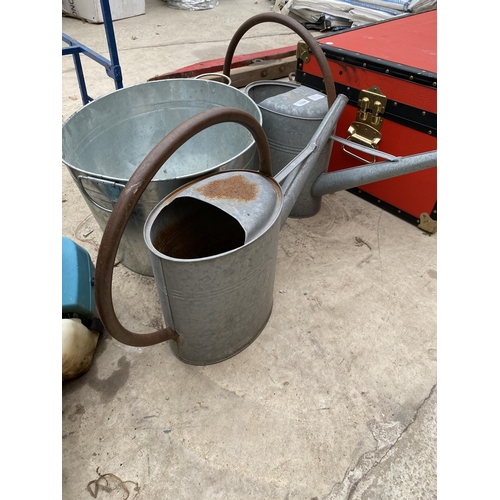 1308 - TWO GALVANISED WATERING CANS AND AN ICE BUCKET