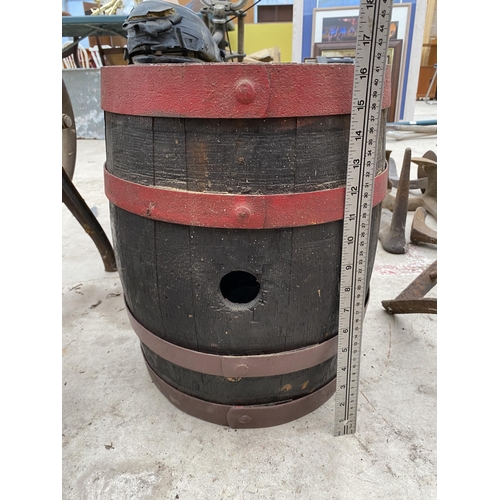 1320 - A SMALL VINTAGE WOODEN AND METAL BANDED BARREL