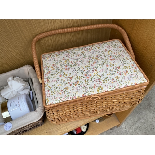 1398 - A WICKER BASKET CONTAING BAYLIS & HARDING TOILETRIES AND A FURTHER WICKER BASKET WITH CLIP ON BOWS