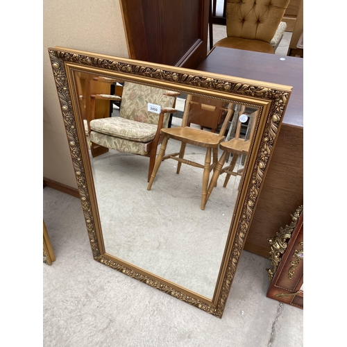 2450 - A  MODERN GILT FRAMED WALL MIRROR, 38X26