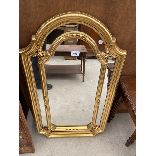 2452 - A MODERN GILT FRAMED WALL MIRROR, 3420