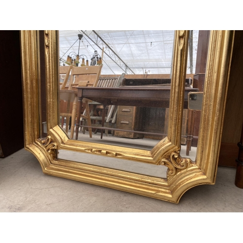 2452 - A MODERN GILT FRAMED WALL MIRROR, 3420