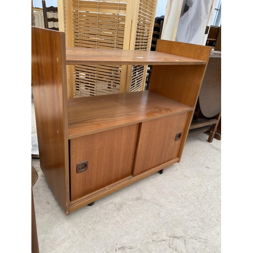 2460 - A RETRO TEAK OPEN BOOKCASE WITH TWO SLIDING DOORS TO BASE, 32