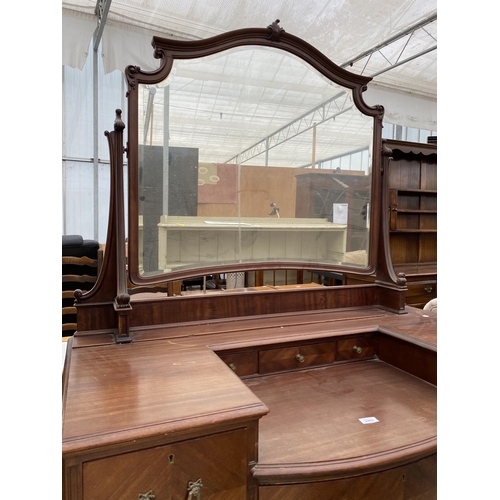 2463 - AN EDWARDIAN MAHOGANY BOWFRONTED DRESSING TABLE ENCLOSING FOUR SHORT, TWO LONG AND THREE JEWELLED DR... 