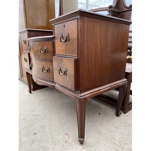 2463 - AN EDWARDIAN MAHOGANY BOWFRONTED DRESSING TABLE ENCLOSING FOUR SHORT, TWO LONG AND THREE JEWELLED DR... 