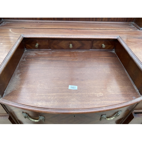 2463 - AN EDWARDIAN MAHOGANY BOWFRONTED DRESSING TABLE ENCLOSING FOUR SHORT, TWO LONG AND THREE JEWELLED DR... 