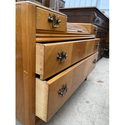 2464 - AN OAK LEBUS (H.L.) DRESSING CHEST OF TWO SHORT AND TWO LONG DRAWERS WITH SMALL ROLL TOP SECTION, 39... 