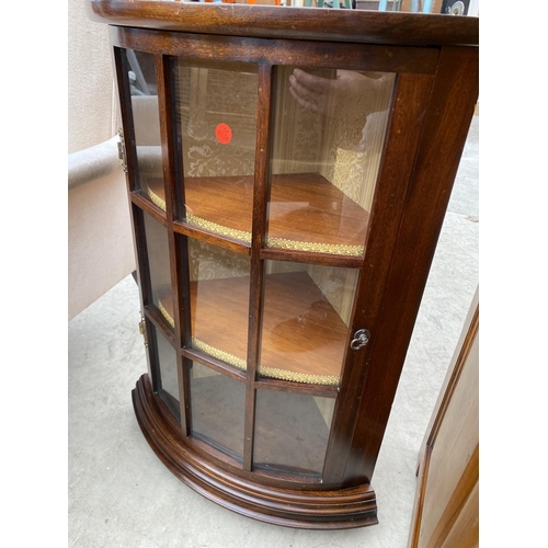 2483 - A SMALL REPRODUCTION BOWFRONTED AND GLAZED CORNER CUPBOARD, 19