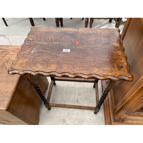 2486 - AN EARLY 20TH CENTURY OAK OCCASIONAL TABLE ON BARLEYTWIST LEGS, 23X16