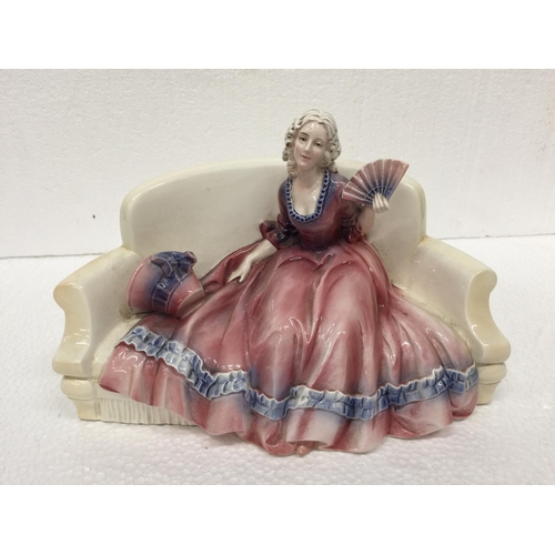 773 - A KAZHUTTE PORCELAIN FIGURINE OF A LADY ON A CHAIR