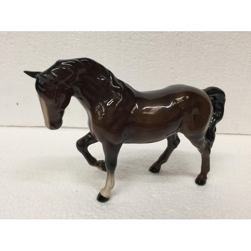 779 - A BESWICK BROWN PRANCING HORSE