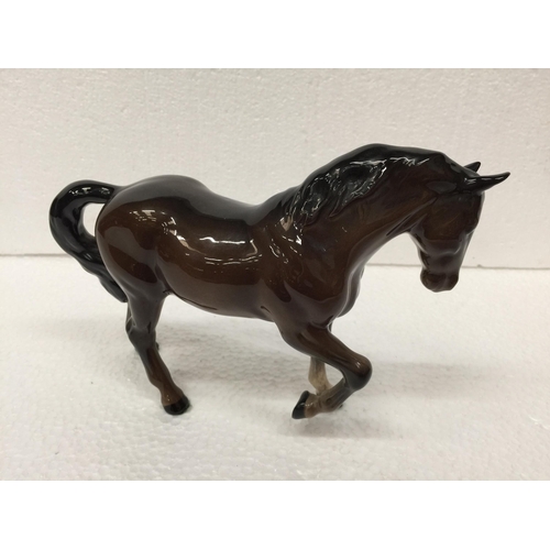 779 - A BESWICK BROWN PRANCING HORSE