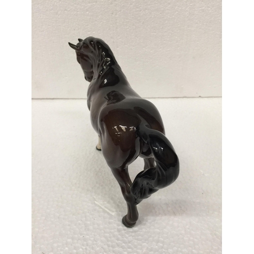 779 - A BESWICK BROWN PRANCING HORSE