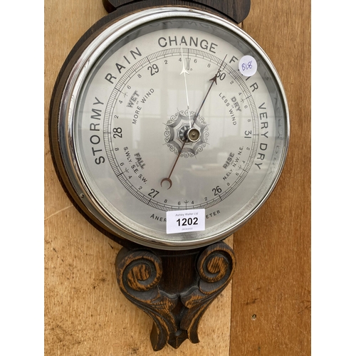 1202 - A VINTAGE WOODEN CASED ANEROID BAROMETER