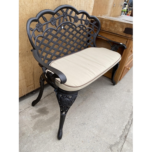 1203 - A CAST ALLOY TWO SEATER GARDEN BENCH WITH CUSHION (L:107CM)