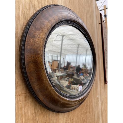 1205 - A WOODEN FRAMED BEVEL EDGED WALL MIRROR