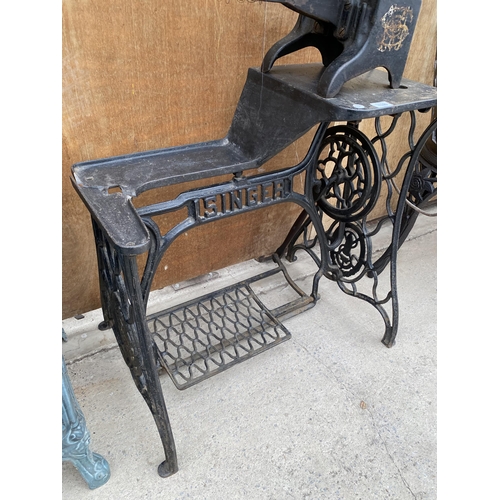 1206 - A VINTAGE INDUSTRIAL SINGER SEWING MACHINE WITH TREADLE BASE