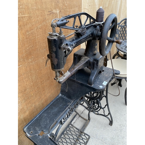 1206 - A VINTAGE INDUSTRIAL SINGER SEWING MACHINE WITH TREADLE BASE