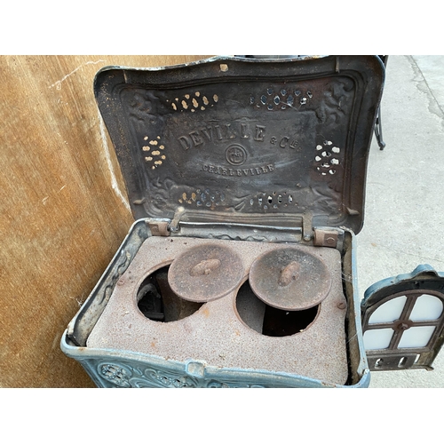 1208 - A VINTAGE DEVILLE AND CO ENAMELED CAST IRON LOG BURNING STOVE (FRONT PLATE REQUIRES ATTENTION - SEE ... 