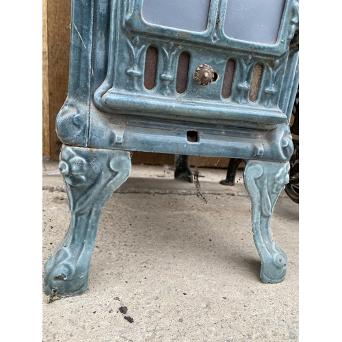 1208 - A VINTAGE DEVILLE AND CO ENAMELED CAST IRON LOG BURNING STOVE (FRONT PLATE REQUIRES ATTENTION - SEE ... 