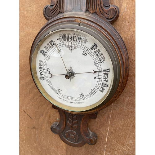 1219 - A VINTAGE WOODEN CASED ANEROID BAROMETER