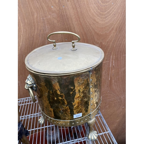 1227 - A VINTAGE BRASS COAL BUCKET WITH LION HEAD HANDLES AND LION PAW FEET