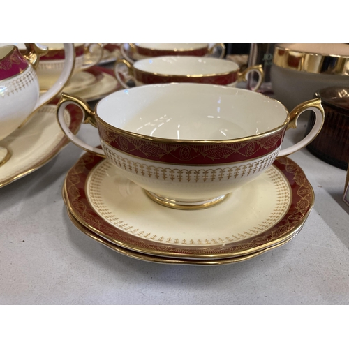 236 - A QUANTITY OF ROYAL ALBERT DINNER WARE WITH A RED BORDER, GOLD FILIGREE ON A CREAM BACKGROUND TO INC... 