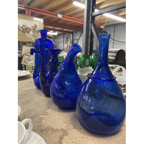 253 - FOUR PIECES OF VINTAGE BLUE GLASS, TWO WITH PONTIL MARKS, TO INCLUDE 'CREMEX SHAMPOOING VASE, ETC