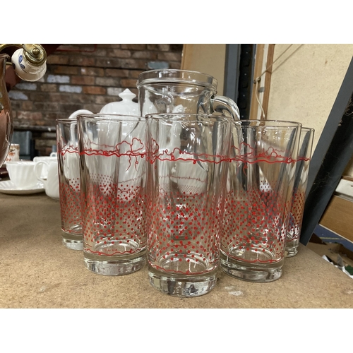 283 - A LEMONADE SET TO INCLUDE A JUG WITH RED DETAIL AND SIX TUMBLERS