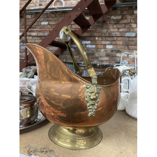 284 - A COPPER FOOTED COAL SCUTTLE WITH BRASS HANDLE AND CERAMIC DETAIL