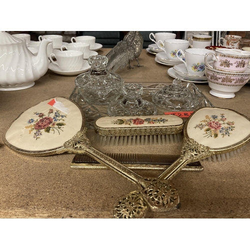 286 - A GLASS DRESSING TABLE SET TO INCLUDE A TRAY AND TRINKET BOWL PLUS A PETIT-POINT HAND MIRROR, BRUSHE... 