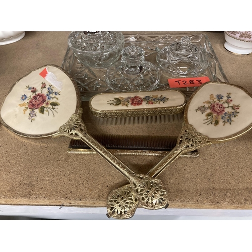 286 - A GLASS DRESSING TABLE SET TO INCLUDE A TRAY AND TRINKET BOWL PLUS A PETIT-POINT HAND MIRROR, BRUSHE... 