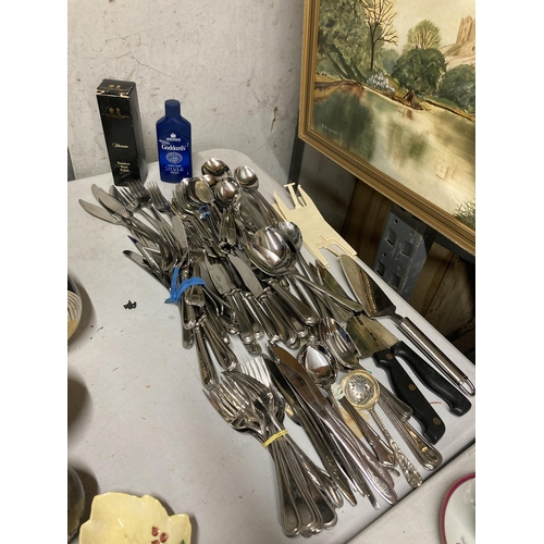 296 - A LARGE QUANTITY OF FLATWARE TO INCLUDE KNIVES, FORKS, SPOONS, PLUS SILVER POLISH