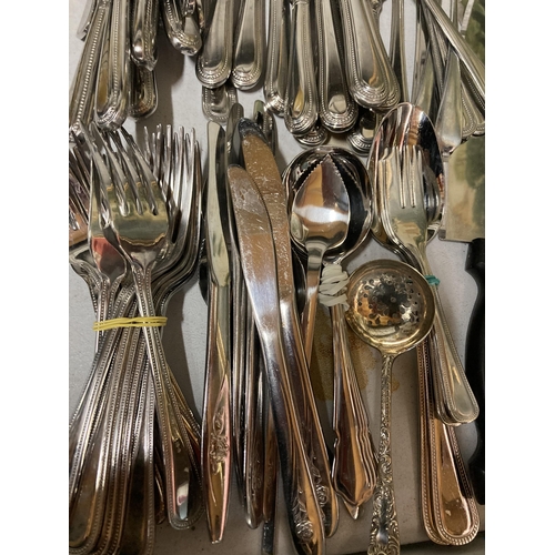 296 - A LARGE QUANTITY OF FLATWARE TO INCLUDE KNIVES, FORKS, SPOONS, PLUS SILVER POLISH