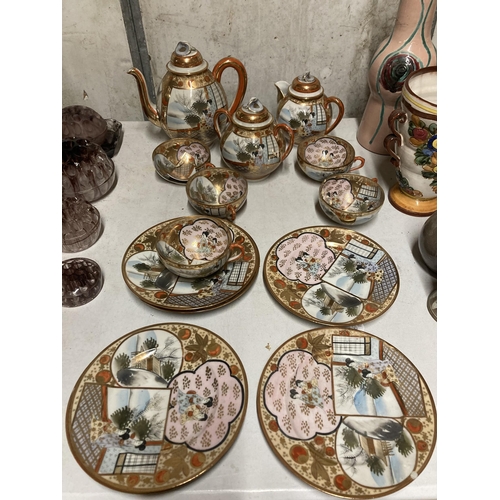 298 - AN ORIENTAL TEASET WITH TEA HOUSEDECORATION TO INCLUDE A TEAPOT, LIDDED JUG AND BOWL, CUPS AND PLATE... 