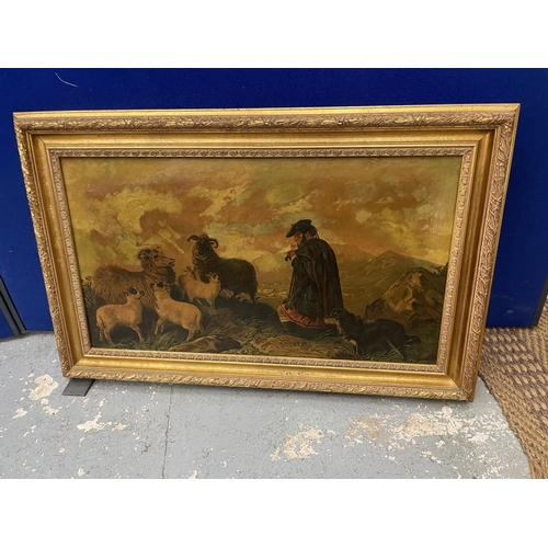 27A - A BELIEVED VICTORIAN OLEOGRAPH OF A SCOTTISH SHEPHERD WITH SHEEP ON A MOUNTAINSIDE IN A GILT FRAME