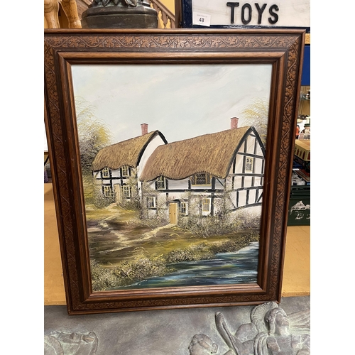 28 - A FRAMED OIL ON CANVAS OF A COUNTRY COTTAGE SIGNED PR FREEMAN