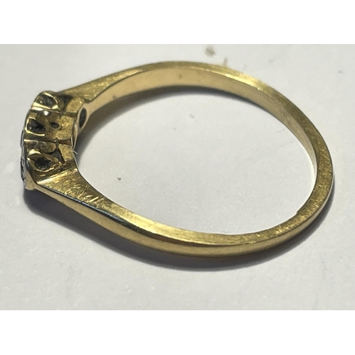 569 - AN 18 CARAT GOLD RING WITH THREE IN LINE DIAMONDS SIZE J GROSS WEIGHT 1.96 GRAMS