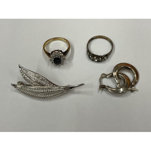 583 - A QUANTITY OF SILVER ITEMS TO INCLUDE A PAIR OF EARRINGS, A BROOCH AND FOUR RINGS