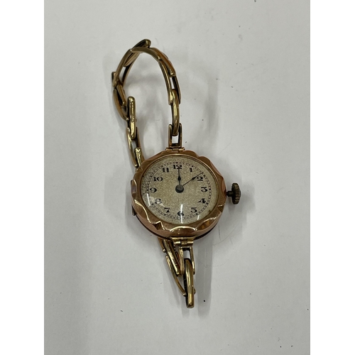 587 - A 9 CARAT GOLD WRISTWATCH WITH 9 CARAT GOLD EXPANDING STRAP