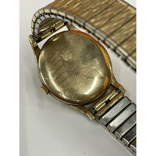 589 - A ACCURIST 9 CARAT GOLD GENTS WRISTWRIST WITH A GOLD PLATED STRAP