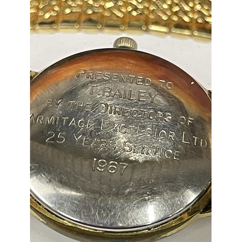 590 - A ROTARY WRIST WATCH WITH ENGRAVING TO THE BACK