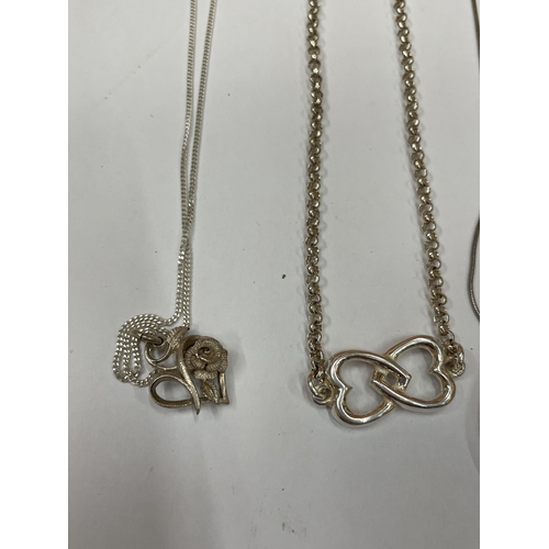 617 - FOUR SILVER NECKLACES WITH PENDANTS