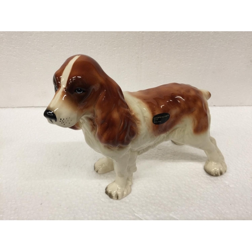 769 - A LARGE COOPERCRAFT SPANIEL TOGETHER WITH A CERAMIC LABRADOR