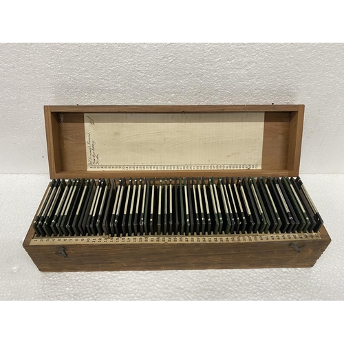 504 - A WOODEN BOX CONTAINING GLASS SLIDES RELATING TO THE BOER WAR