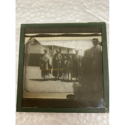 504 - A WOODEN BOX CONTAINING GLASS SLIDES RELATING TO THE BOER WAR