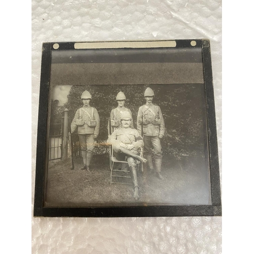 504 - A WOODEN BOX CONTAINING GLASS SLIDES RELATING TO THE BOER WAR