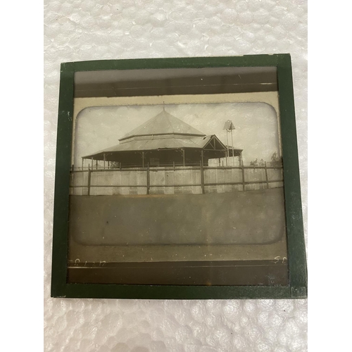 504 - A WOODEN BOX CONTAINING GLASS SLIDES RELATING TO THE BOER WAR