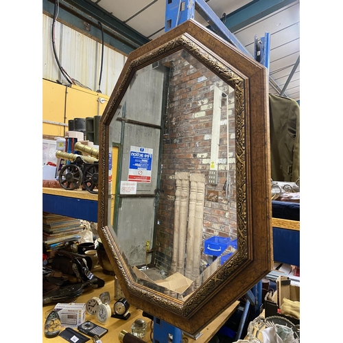 528 - A WOODEN FRAMED OCTAGONAL BEVELLED MIRROR 79CM X 64CM