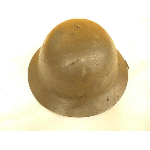 470 - A GREEN PAINTED METAL BRODIE HELMET AND LINER